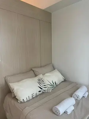 a bed with two pillows and two towels on it at SMDC Jazz Residences Makati City Philippines in Manila