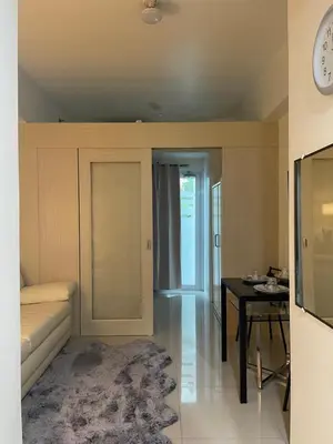 a living room with a couch and a table at SMDC Jazz Residences Makati City Philippines in Manila