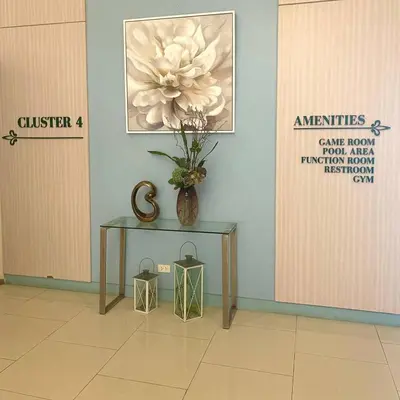 a table with a vase on it next to a door at Casas Reales Staycation & Rentals in Biñan