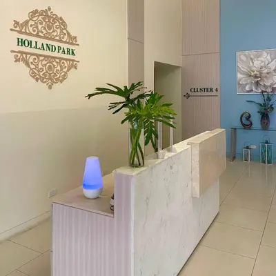 a lobby with a blue vase sitting on a counter at Casas Reales Staycation & Rentals in Biñan
