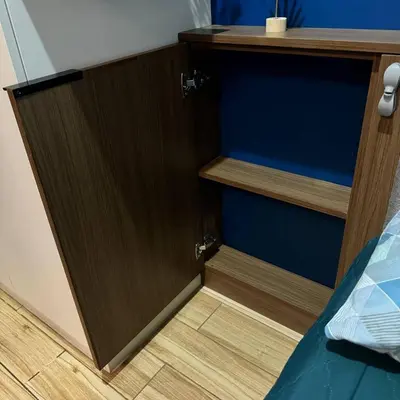 a wooden door in a room with a wooden floor at Casas Reales Staycation & Rentals in Biñan