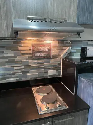 a toaster oven sitting on top of a counter at Lovely 1 bedroom at Vista Shaw Residences in Manila