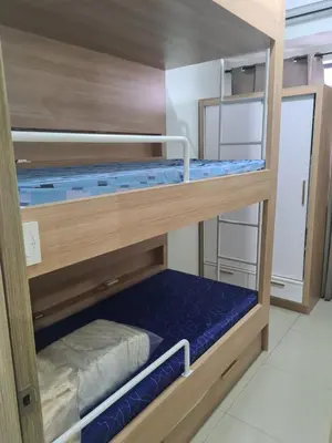 a room with two bunk beds in a room at SHORE 2 Res TOWER 1 -2 BR unit in Manila