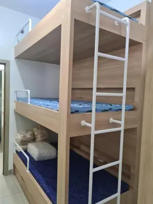 a bunk bed with a ladder in a room at SHORE 2 Res TOWER 1 -2 BR unit in Manila