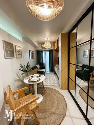 a living room with a table and a couch at Mi Casa in Manila