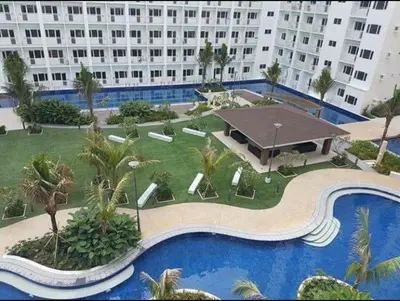 arial view of a large building with a swimming pool at Mi Casa in Manila