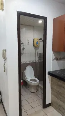 a bathroom with a toilet in a room at Hospital ng Manila front delux le mirage de malate in Manila