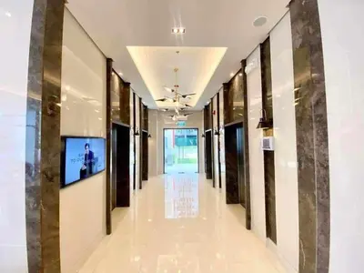 an empty hallway in a building with a television on the wall at 2BR SMDC Bloom Residences Near NAIA Wi-fi +Netflix in Manila
