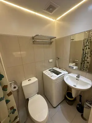 a bathroom with a toilet and a sink at Shell Residences, Pasay near NAIA MOA SMX PICC in Manila