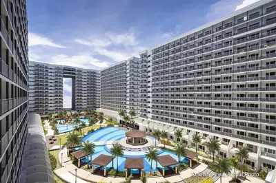 an overhead view of a large apartment building with a pool at Shell Residences, Pasay near NAIA MOA SMX PICC in Manila
