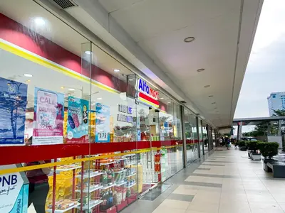 a store aisle of a shopping mall at Shore2 Luxurious & Homely Suite near MOA in Manila