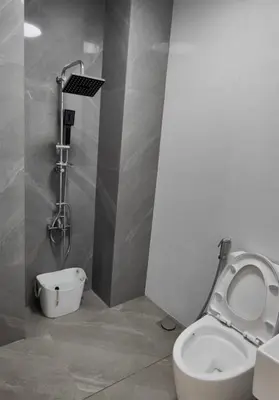 a bathroom with a toilet and a shower at Sky Haven Staycation in Rizal