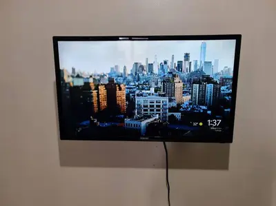 a flat screen tv hanging on a wall at 1 Bedroom Condo In Little Baguio Terraces, San Juan City in Manila