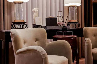 a dressing room with a chair and a dressing table at Brittany Hotel Villar City in Cavite