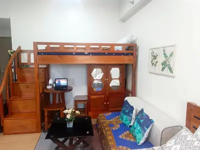 a living room with a bunk bed and a couch at Happy Stays B - 300mbps - 65