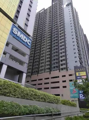 a large building with a samsung sign in front of it at Minju Staycation at Fame Residences Free Netflix & Wifi in Manila