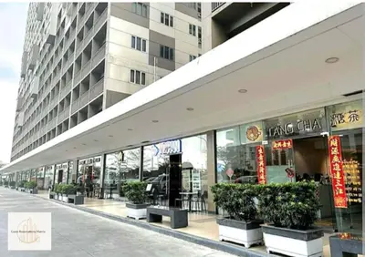 a store front of a building with potted plants at Hawaii Suite by Guest Reservations Manila in Manila
