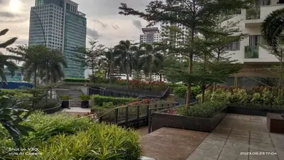 a garden with plants and trees in a city at SonSon at Manhattan Plaza Tower 1, Araneta, Cubao, Quezon City in Manila