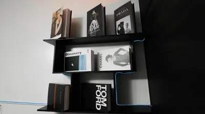 a black book shelf with books on it at Smart Cozy Home Air Residences Makati in Manila