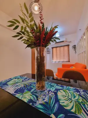 a vase of flowers sitting on a table at Modern Minimalist Condo near Airport in Manila