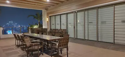 a large dining room with a table and chairs at Casa Antonio at Fairway Terraces Family Penthouse 2BR Wi-Fi Nr Golf, Airport, Fort BGC in Manila