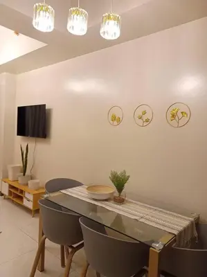 a dining room with a table and chairs at Beautiful High End Condo in City Center, Manila in Manila