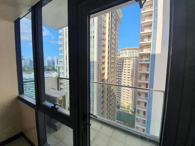 a view of a city skyline from a window at Beautiful High End Condo in City Center, Manila in Manila