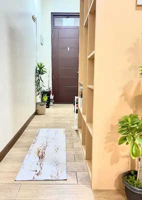 a hallway with a door and a rug on the floor at Bea’s Transient (Condo Studio Room for 2!) in Manila