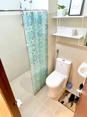 a bathroom with a toilet and a shower at Bea’s Transient (Condo Studio Room for 2!) in Manila