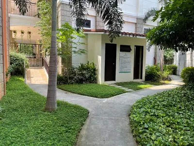 a sidewalk in front of a building with a sign on it at Bea’s Transient (Condo Studio Room for 2!) in Manila