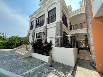 a large white building with stairs and balconies at Bea’s Transient (Condo Studio Room for 2!) in Manila
