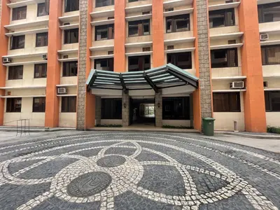 a building with a mosaic floor in front of a building at Bea’s Transient (Condo Studio Room for 2!) in Manila