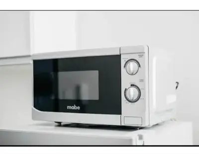 a microwave oven sitting on top of a counter at 2 Bed 2 Bath condo in Air Residences in Manila