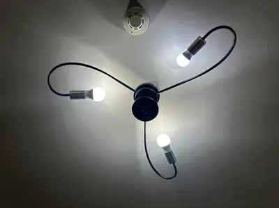 a lamp with two lights on a wall at Tropical Balcony Pool View, 14th floor, MOA, Netflix, Airport at Shell Residence in Manila