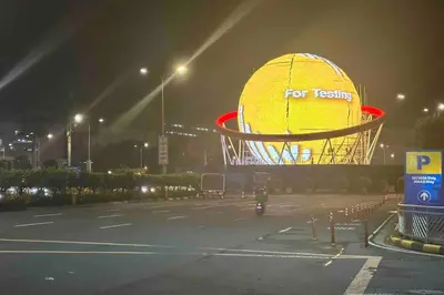 a large yellow ball in a parking lot at night at Tropical Balcony Pool View, 14th floor, MOA, Netflix, Airport at Shell Residence in Manila
