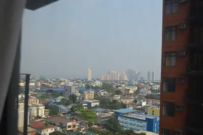 a view of a city from a building at Cozy Studio with Beautiful View & FREE Netflix Access in Manila