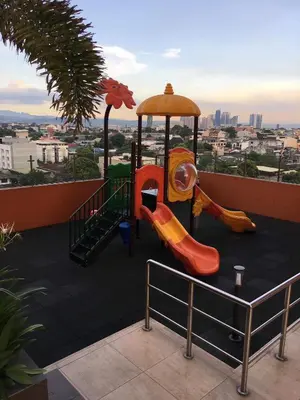 a childrens playground with slides and a carousel at Cozy Studio with Beautiful View & FREE Netflix Access in Manila