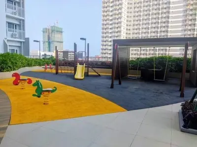 a playground in a city with a play area at Breeze Residences with Ocean view by Bmars in Manila
