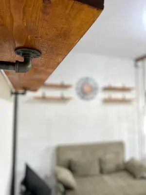 a living room with a couch and a wooden ceiling at Casa Cabilao Staycation in Santa Rosa