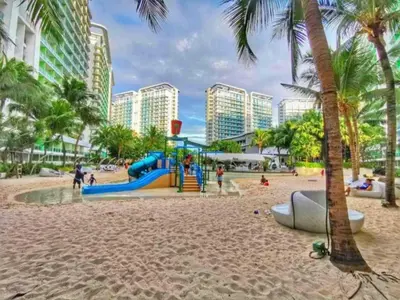 a playground on the beach in front of condos at Azure resort Paranaque deluxe 8 plus 2toddler free in Manila