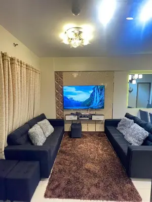 a living room with two couches and a flat screen tv at Two Bedroom Fully Furnished 70sqm CONDO MIREA RESIDENCES PASIG in Manila