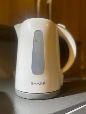 a white coffee mug with a remote control in it at Two Bedroom Fully Furnished 70sqm CONDO MIREA RESIDENCES PASIG in Manila