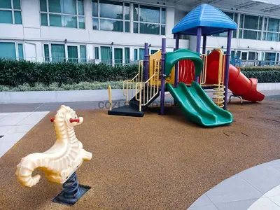 a playground with a plastic seahorse next to a slide at The Beacon Makati by Cozi Condotels in Manila