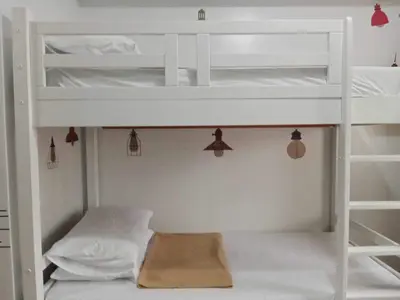 a bedroom with two bunk beds in a room at Minimalist Condo Studio City Tower 2 Filinvest Alabang Muntinlupa in Manila