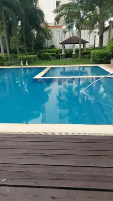 a blue swimming pool with two white birds in it at Minimalist Condo Studio City Tower 2 Filinvest Alabang Muntinlupa in Manila