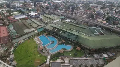 an aerial view of a park with a swimming pool at Prisma residence Celeste tower PH 16B with fully furnished and fast wifi for rent in Manila