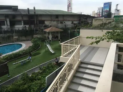 a view of a park with a slide and a playground at Prisma residence Celeste tower PH 16B with fully furnished and fast wifi for rent in Manila