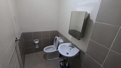 a small bathroom with a toilet and a sink at Prisma residence Celeste tower PH 16B with fully furnished and fast wifi for rent in Manila