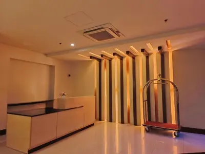 a kitchen with a island in a room with windows at Near Terminal 3 Two Palmtree Villas- Walking distance only (JJRMK) in Manila