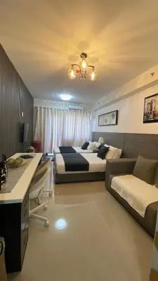 a bedroom with two beds and a couch at Condo Suite/Apartment Pasay SM MOA - Stay Cozy & Boujee in Manila